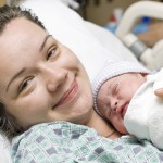 Happy mother with newborn baby